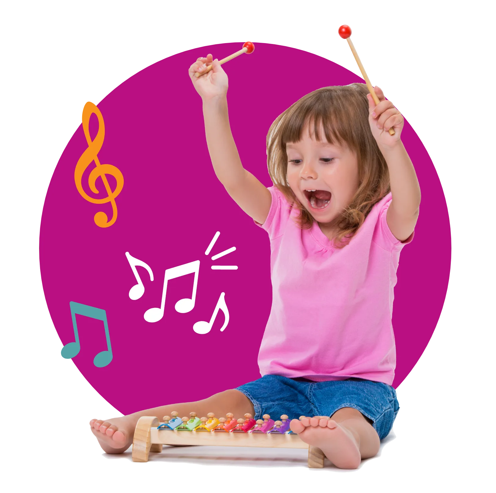 A cheering little girl in a pink shirt raising two mallets over a rainbow xylophone